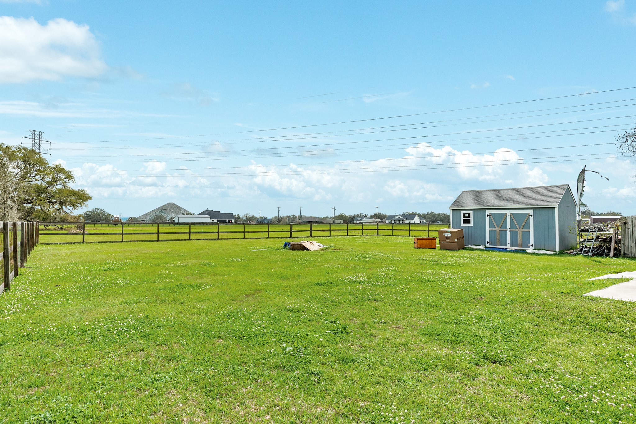 613 Winchester Trail Angleton, TX 77515 - Photo 7 of 32 a view of a house with a big yard