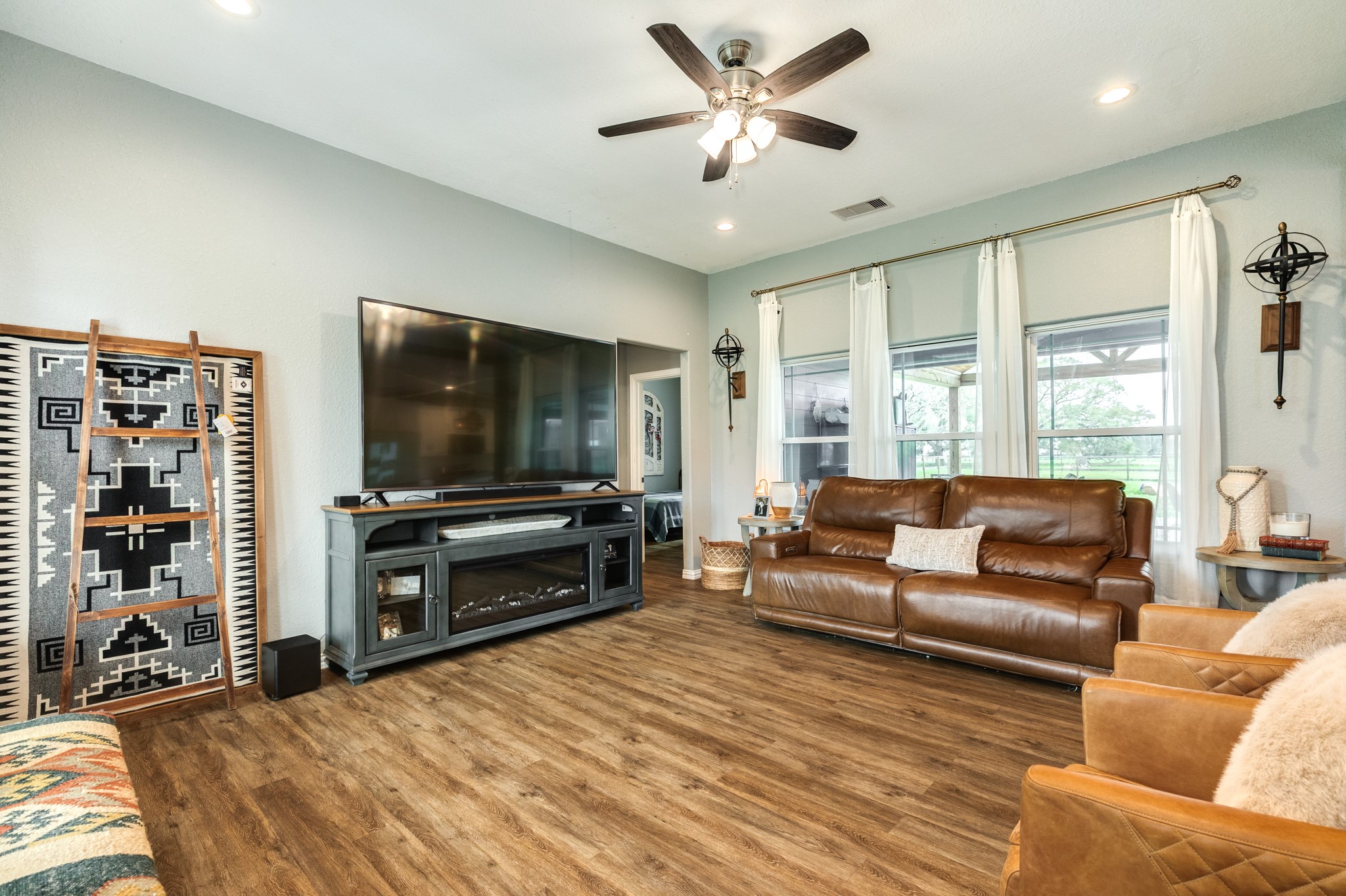 613 Winchester Trail Angleton, TX 77515 - Photo 9 of 32 a living room with furniture and a flat screen tv