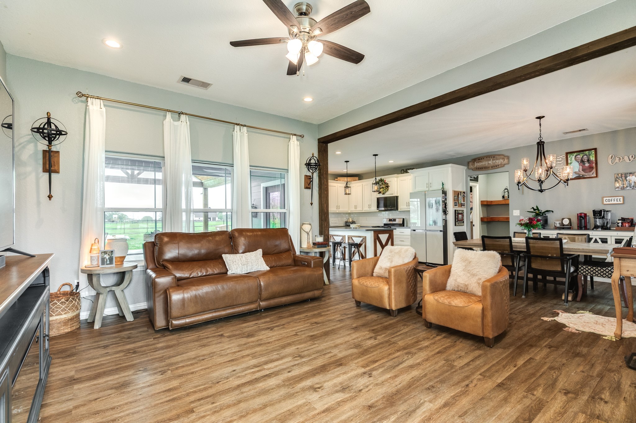 613 Winchester Trail Angleton, TX 77515 - Photo 10 of 32 a living room with furniture and a large window