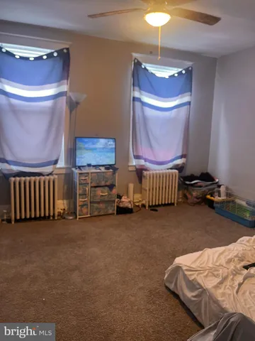 a room with a bed and a lamp