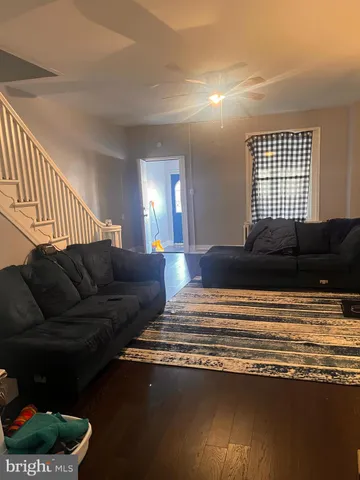 a living room with a couch and a window