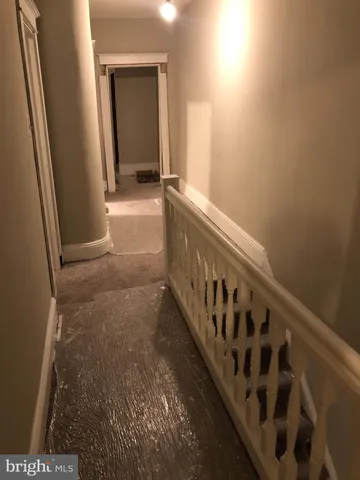 a view of a porch with wooden floor
