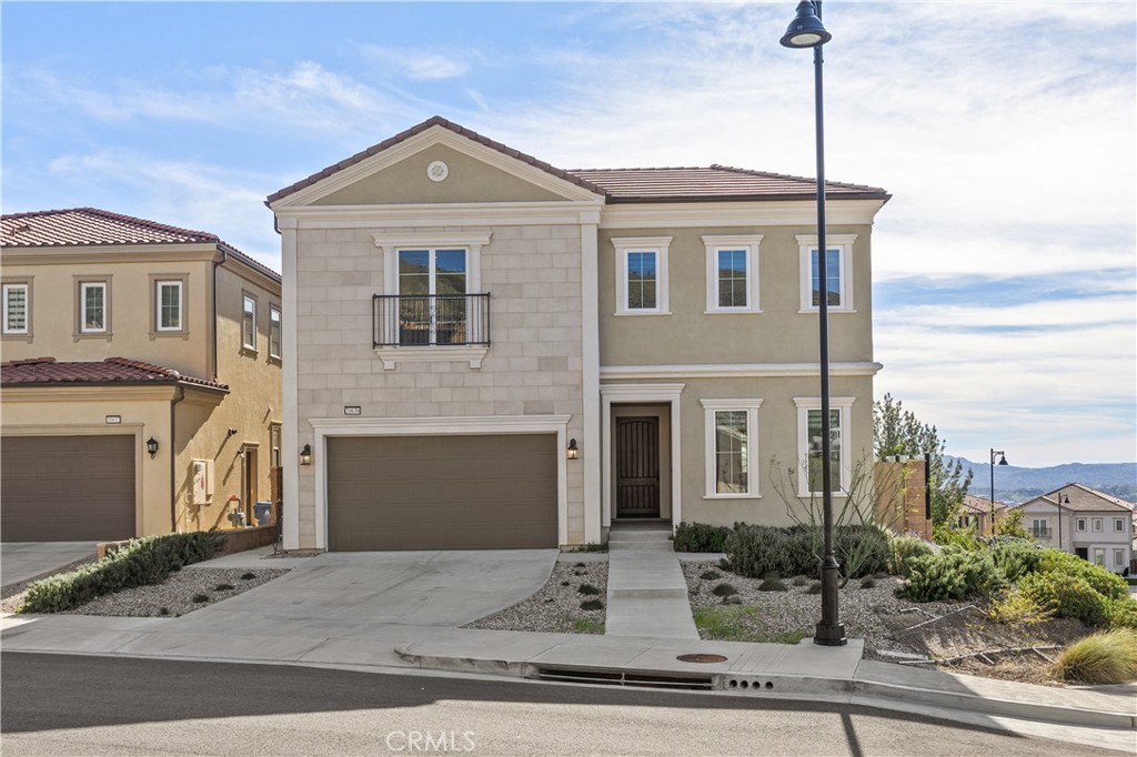 20638 Deer Grass Court Porter Ranch, CA 91326 - Photo 2 of 50 a front view of a house with yard