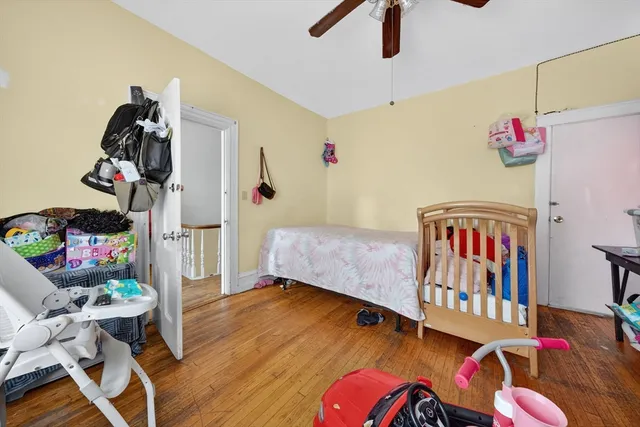 a bed room with a bed and a flat screen tv