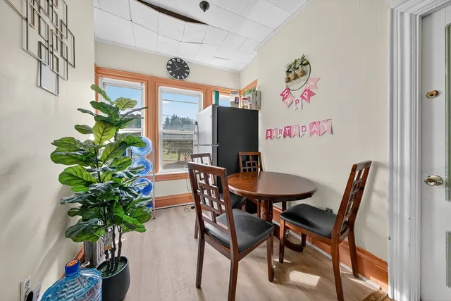 a bedroom with bed and wooden floor
