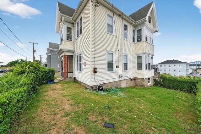 a view of a house with a yard porch and sitting area