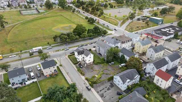 an aerial view of residential houses with outdoor space