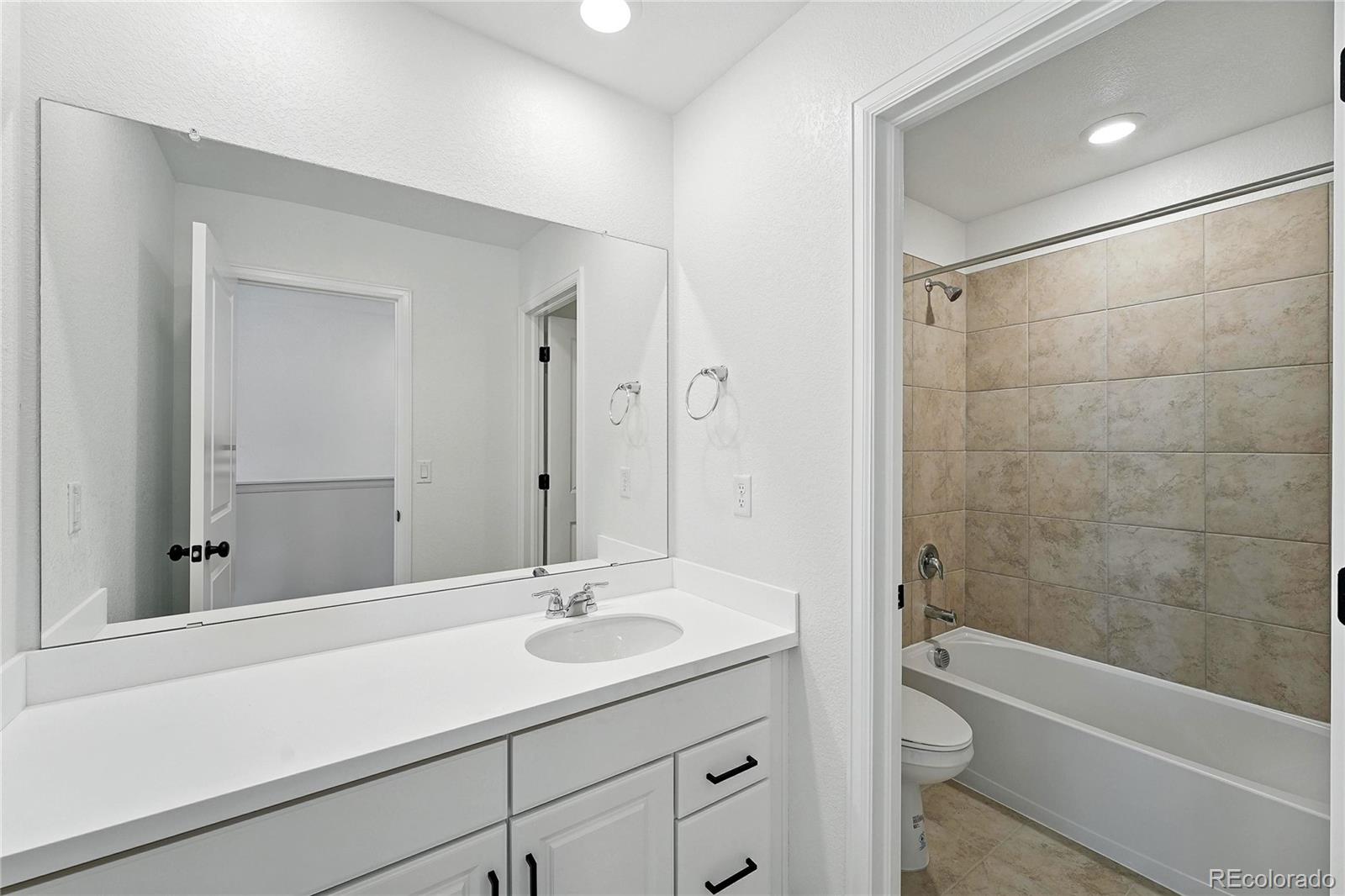 39712 Penn Road Elizabeth, CO 80107 - Photo 17 of 36 a bathroom with a sink a toilet and shower