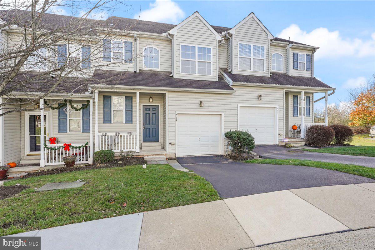 652 Onward Avenue, Unit 56 Phoenixville, PA 19460 - Photo 1 of 35 a front view of a house with a yard and garage