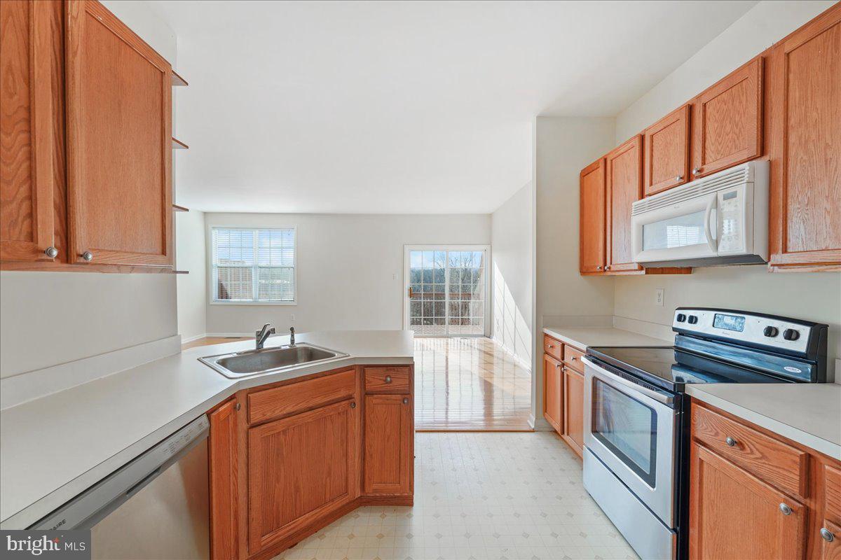 652 Onward Avenue, Unit 56 Phoenixville, PA 19460 - Photo 15 of 35 a kitchen that has a sink and a stove