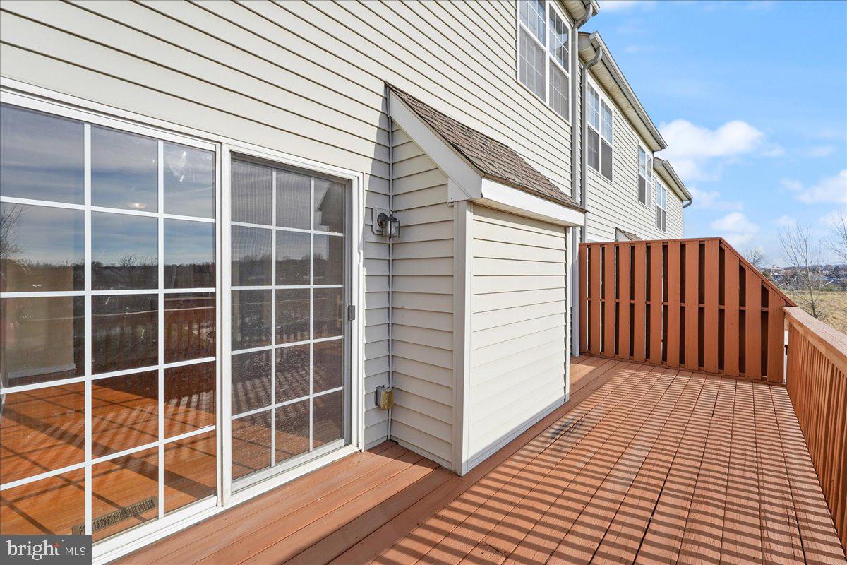 652 Onward Avenue, Unit 56 Phoenixville, PA 19460 - Photo 17 of 35 a view of a balcony with wooden floor and fence