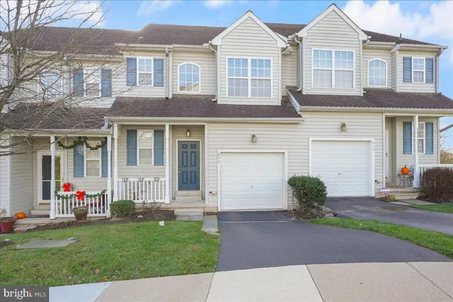 a view of a yard in front view of a house