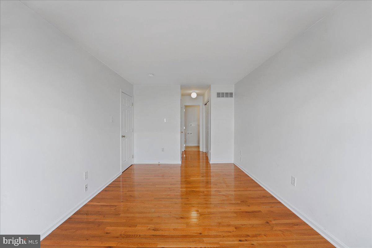 652 Onward Avenue, Unit 56 Phoenixville, PA 19460 - Photo 26 of 35 a view of an empty room with wooden floor