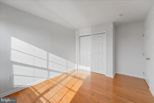 a view of a room with wooden floor