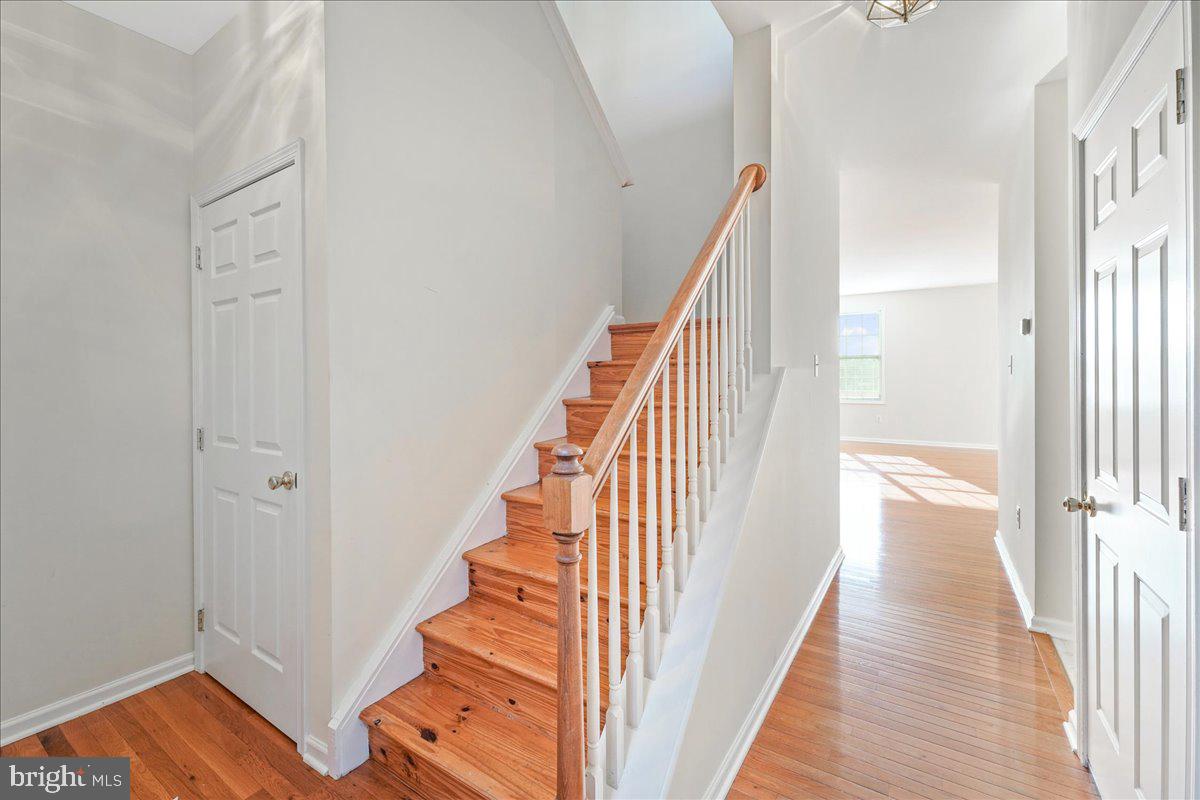 652 Onward Avenue, Unit 56 Phoenixville, PA 19460 - Photo 5 of 35 a view of a hallway with wooden floor and staircase