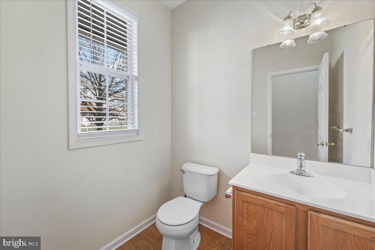 652 Onward Avenue, Unit 56 Phoenixville, PA 19460 - Photo 6 of 35 a bathroom with a toilet sink and mirror