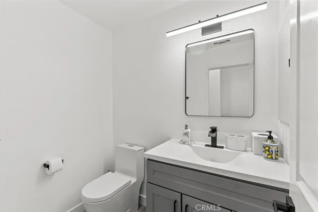 a view of kitchen with sink microwave and refrigerator