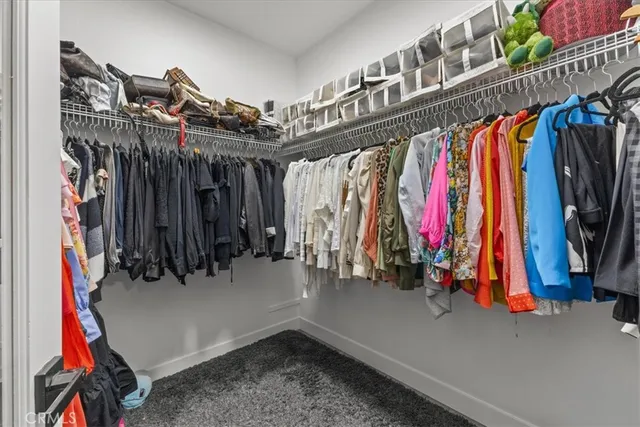 a bedroom with a bed and a night stand