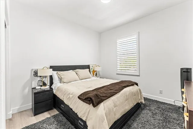 a bedroom with a bed and a dresser