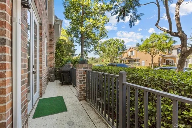 a view of a pathway along with potted plants