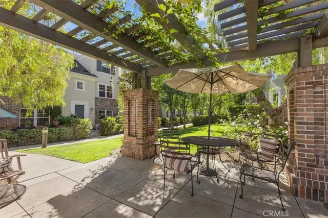 an aerial view of a house with a mountain