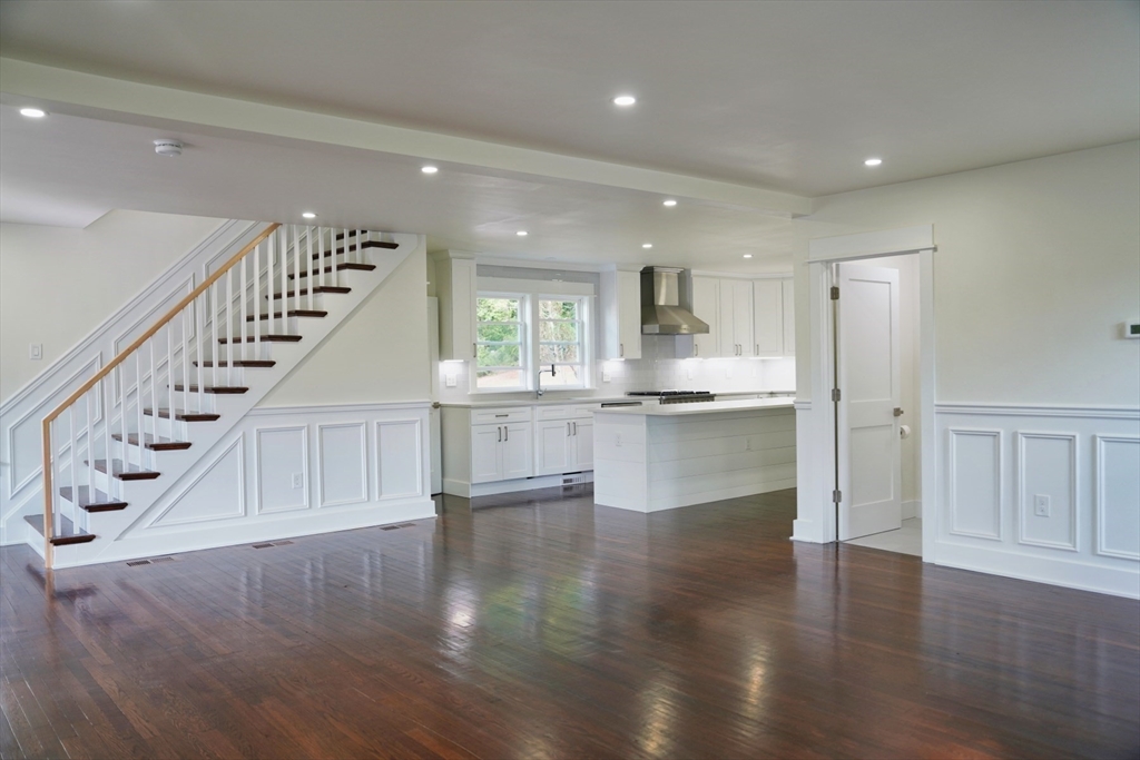 281 Forest Street Arlington, MA 02474 - Photo 3 of 26 a view of an entryway with kitchen and wooden floor