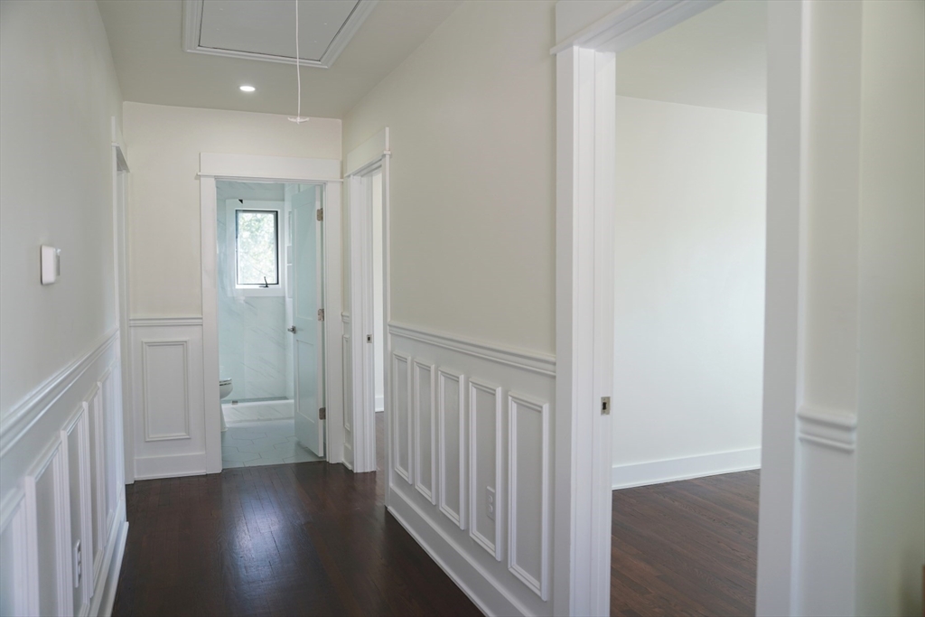 281 Forest Street Arlington, MA 02474 - Photo 10 of 26 a view of a hallway with wooden floor