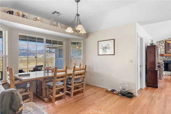 a very nice looking room with many windows and furniture
