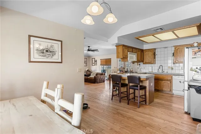 a living room with furniture a dining table and chairs