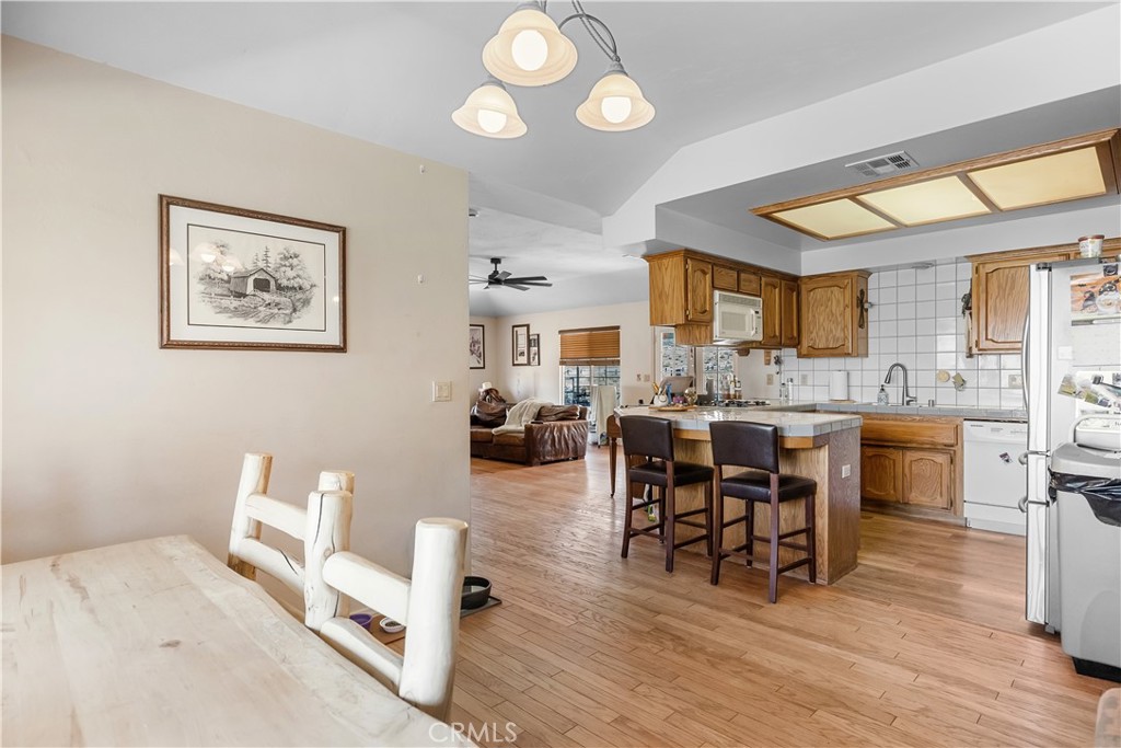 18888 Pellisier Road Tehachapi, CA 93561 - Photo 13 of 43 a living room with furniture a dining table and chairs