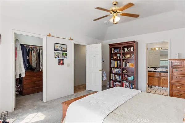 a bedroom with a bed and closet