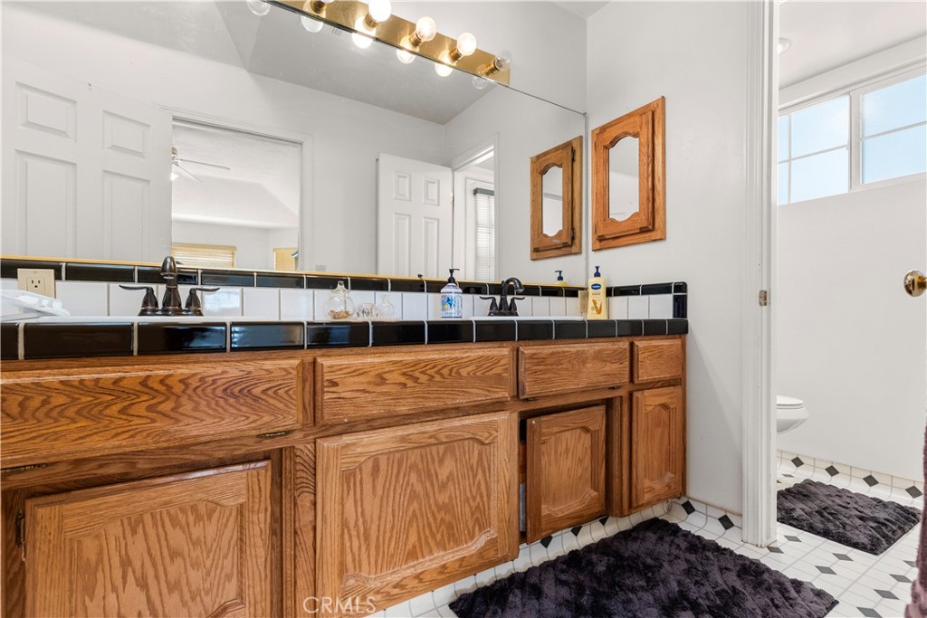 18888 Pellisier Road Tehachapi, CA 93561 - Photo 20 of 43 a bathroom with a sink and a mirror
