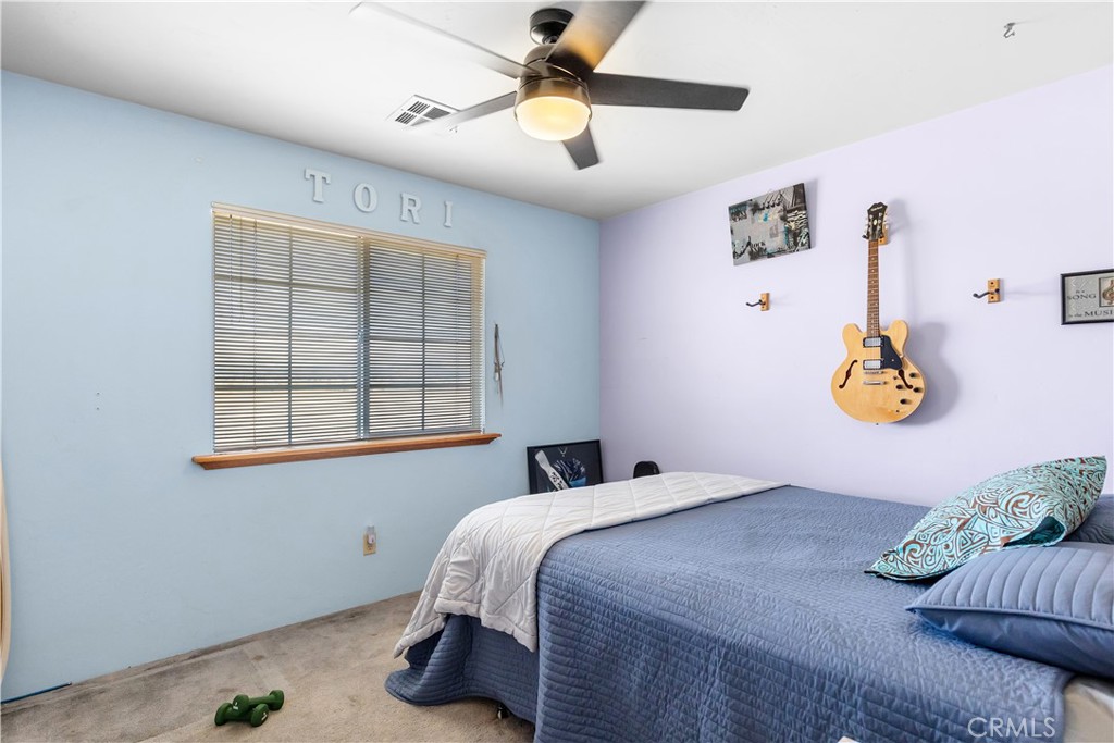 18888 Pellisier Road Tehachapi, CA 93561 - Photo 23 of 43 a bedroom with a bed and a window