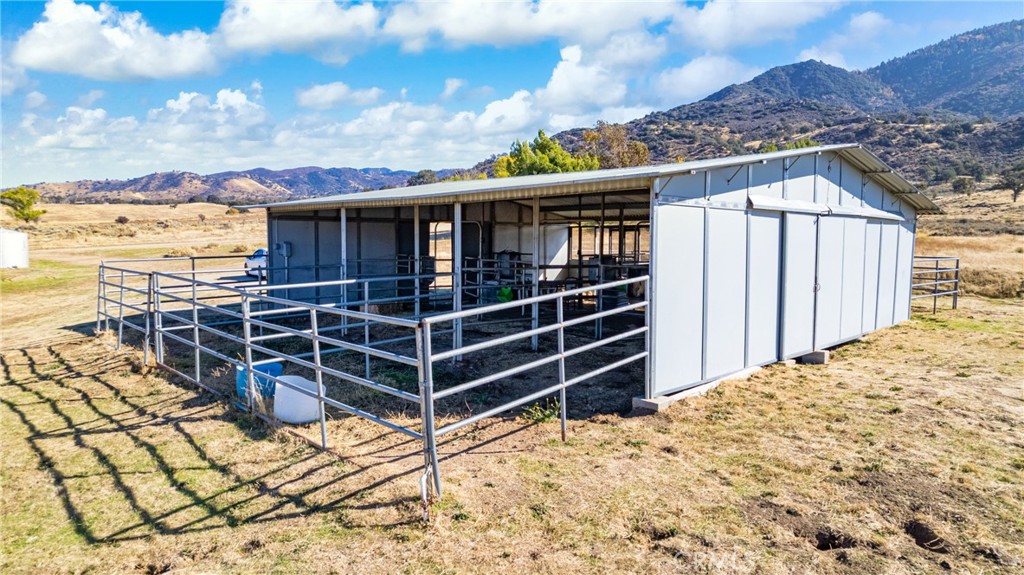 18888 Pellisier Road Tehachapi, CA 93561 - Photo 31 of 43 a view of a house with a wooden fence