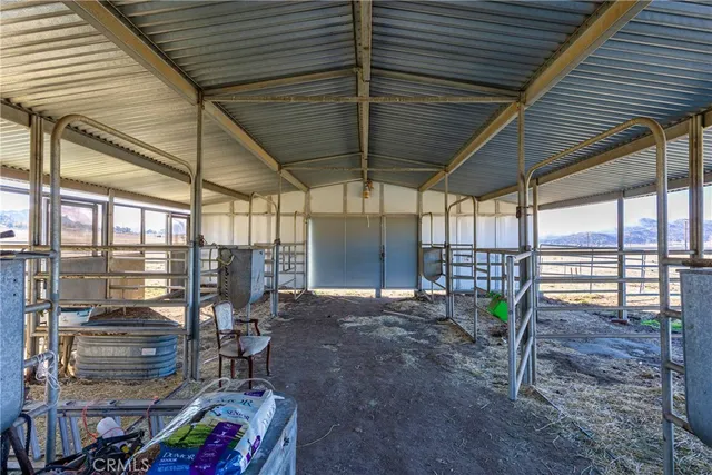 a view of a chairs and table in the patio
