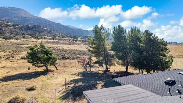 a view of a backyard of a house