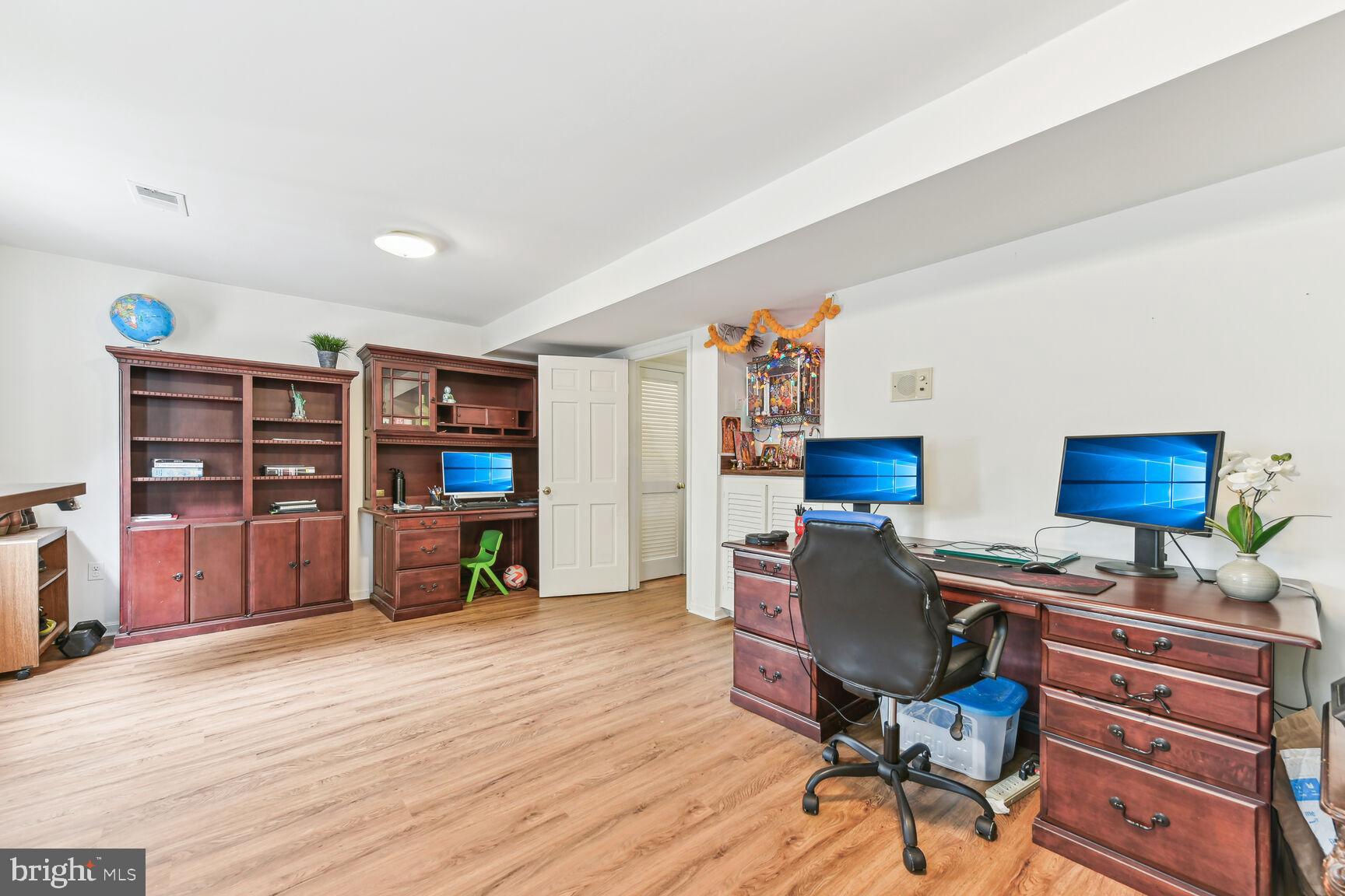 6719 Baron Road McLean, VA 22101 - Photo 21 of 30 a view of a workspace with furniture and wooden floor
