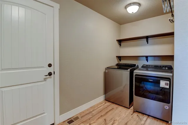 a utility room with washer and dryer