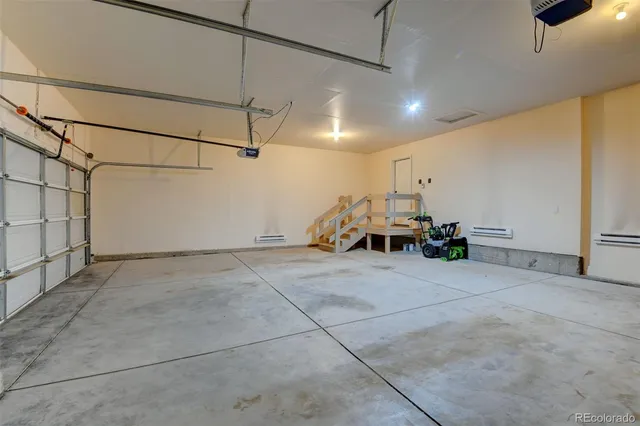a view of a livingroom with furniture and a ceiling fan