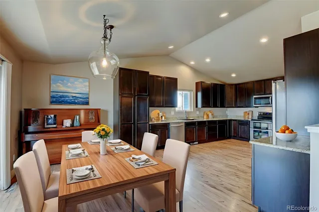 a view of kitchen dining table and chairs