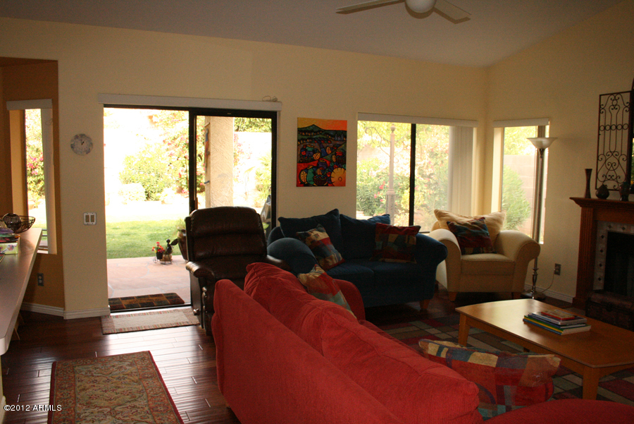 5926 East Grandview Road Scottsdale, AZ 85254 - Photo 11 of 18 a living room with furniture and a large window