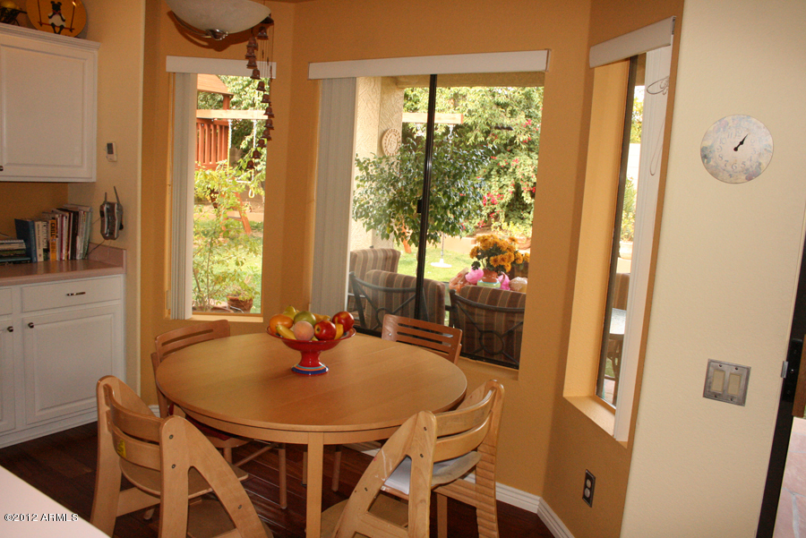 5926 East Grandview Road Scottsdale, AZ 85254 - Photo 14 of 18 a dining room with furniture and window