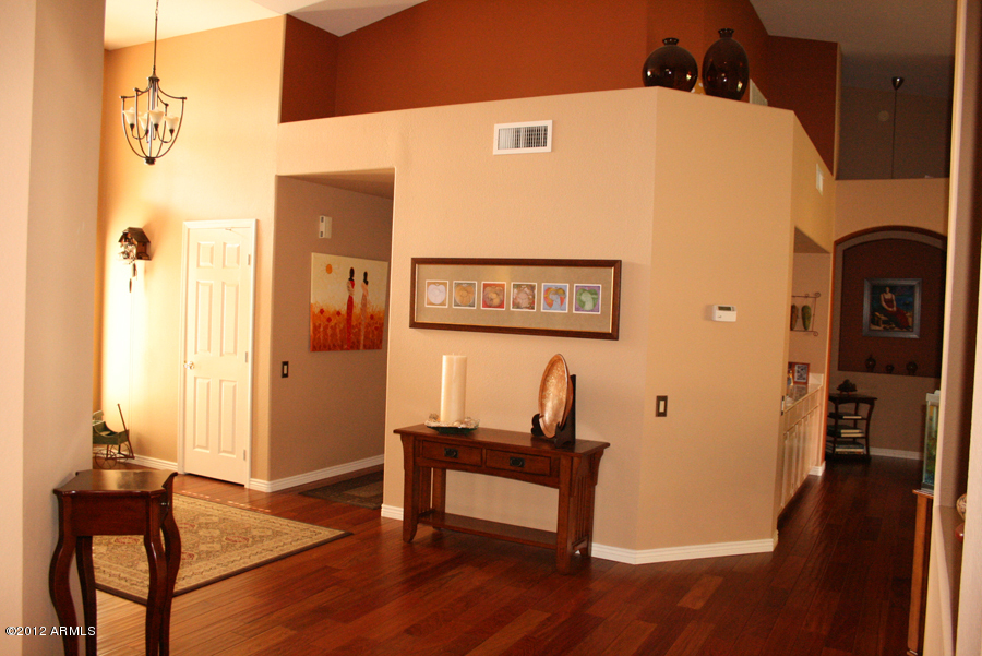 5926 East Grandview Road Scottsdale, AZ 85254 - Photo 2 of 18 a view of a hallway with wooden floor and a bathroom