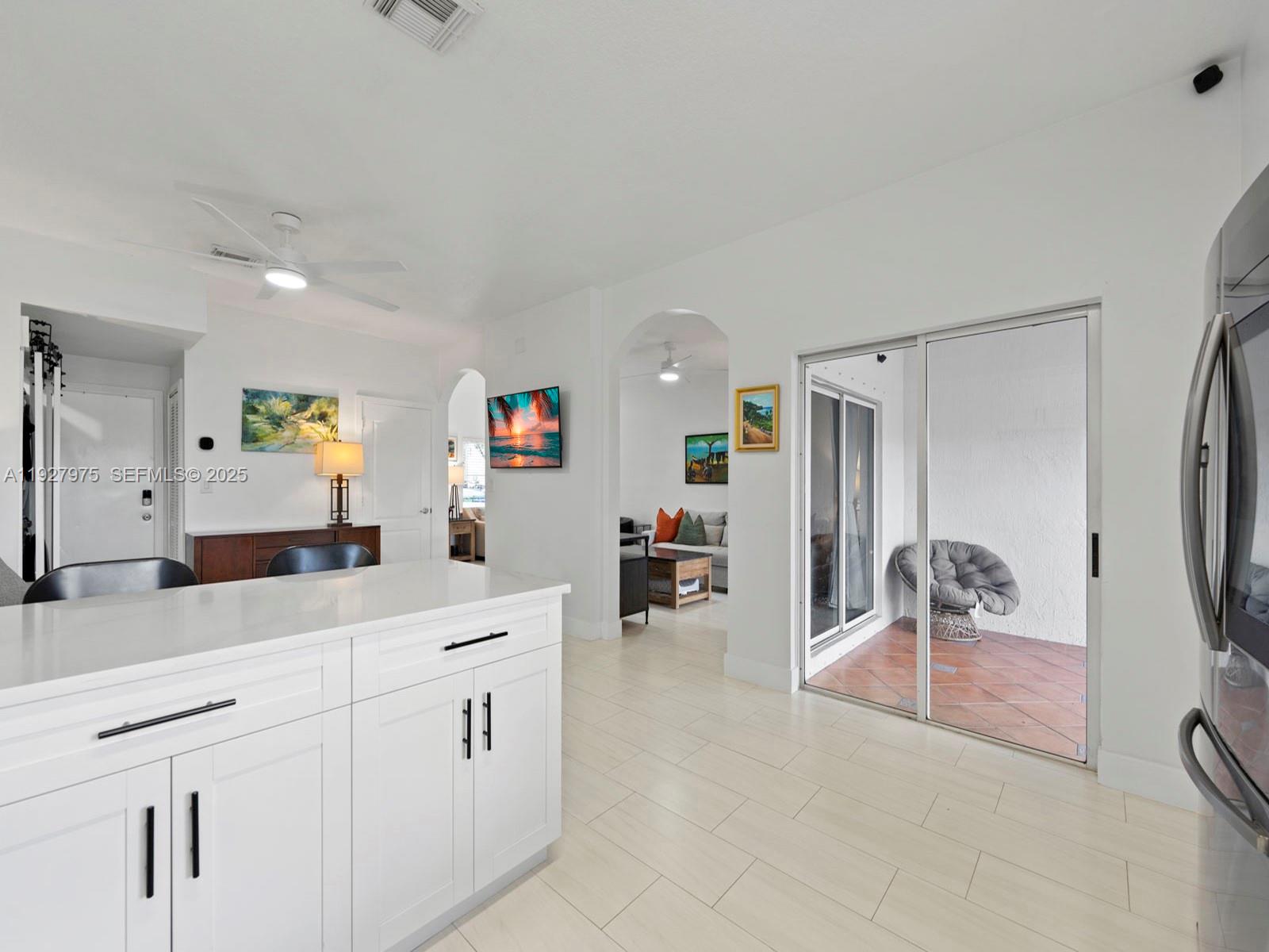 12881 Southwest 49th Court, Unit 12881 Miramar, FL 33027 - Photo 15 of 47 a kitchen with counter top space and cabinets