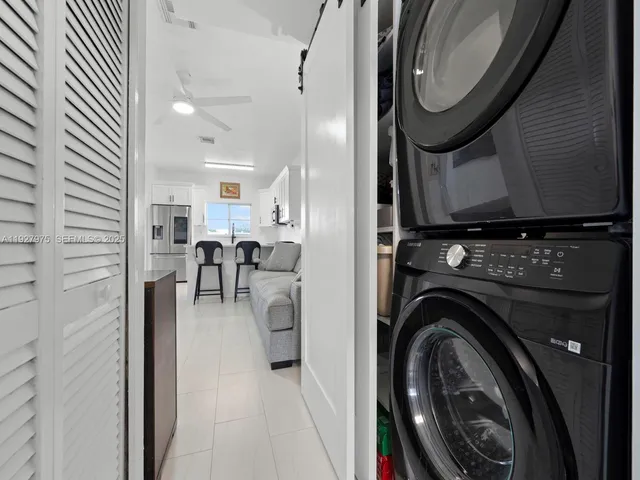 a view of a kitchen with washer and dryer