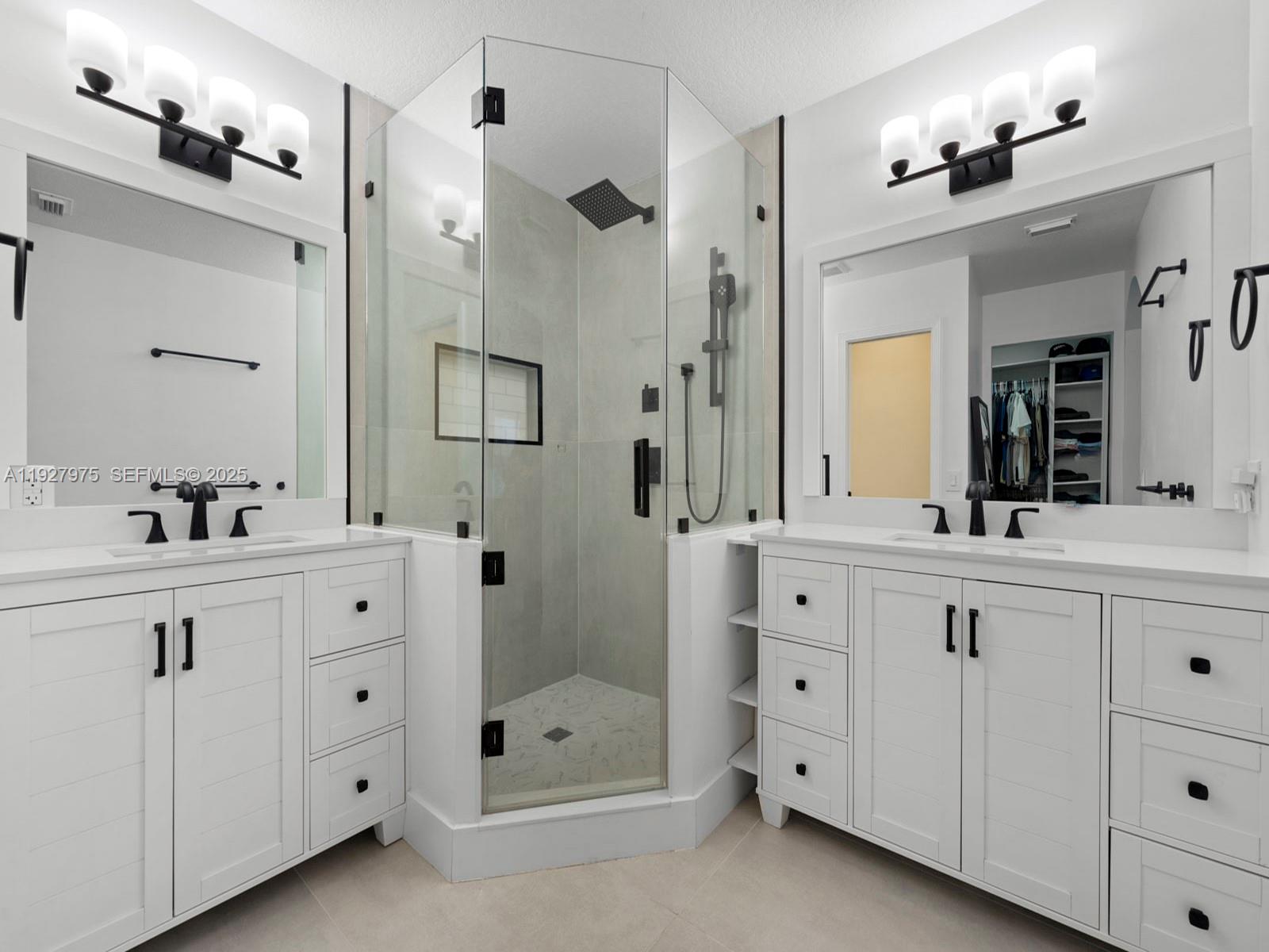 12881 Southwest 49th Court, Unit 12881 Miramar, FL 33027 - Photo 23 of 47 a spacious bathroom with a shower sink double and mirror