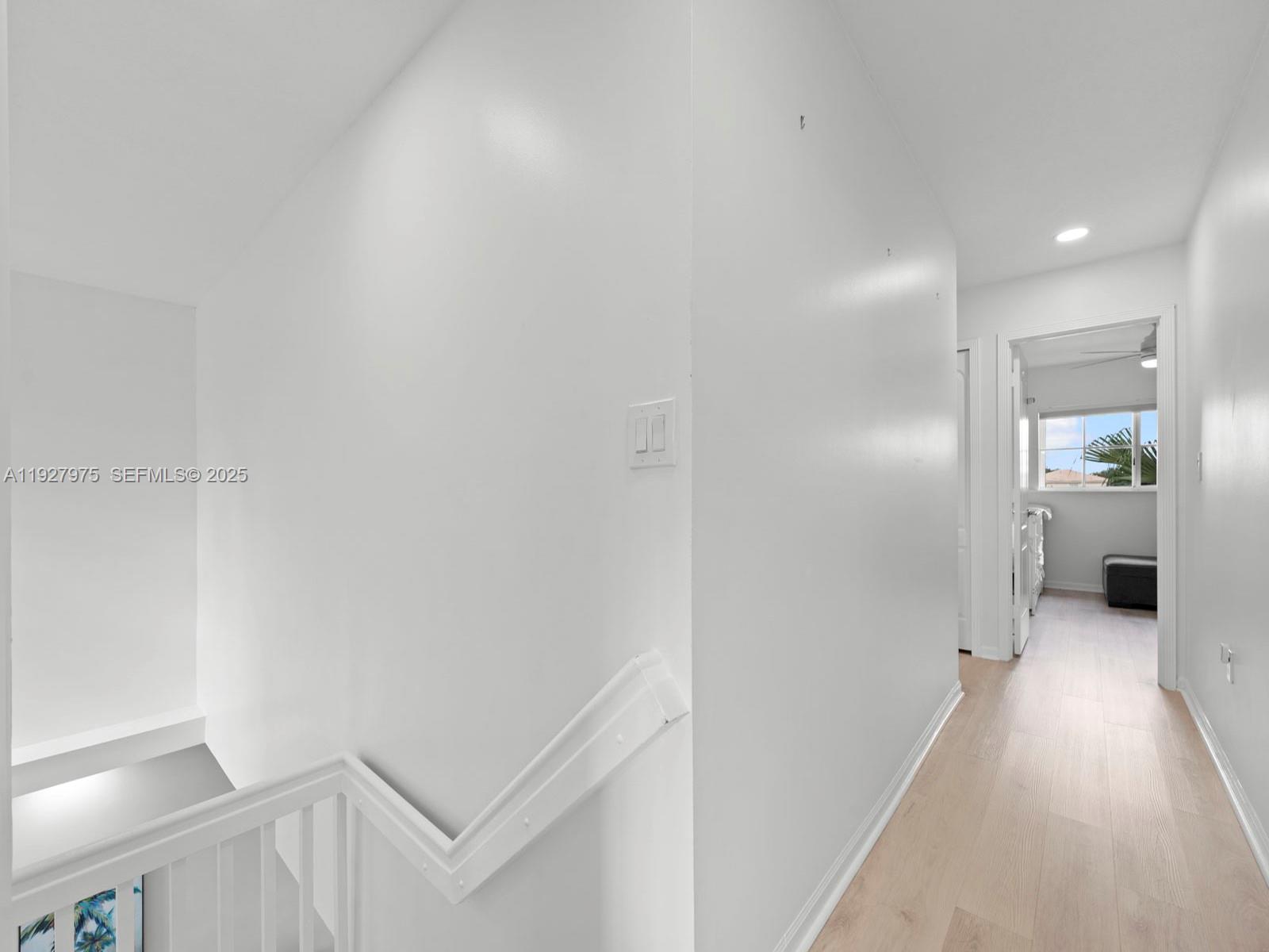 12881 Southwest 49th Court, Unit 12881 Miramar, FL 33027 - Photo 25 of 47 a view of a hallway with wooden shelves