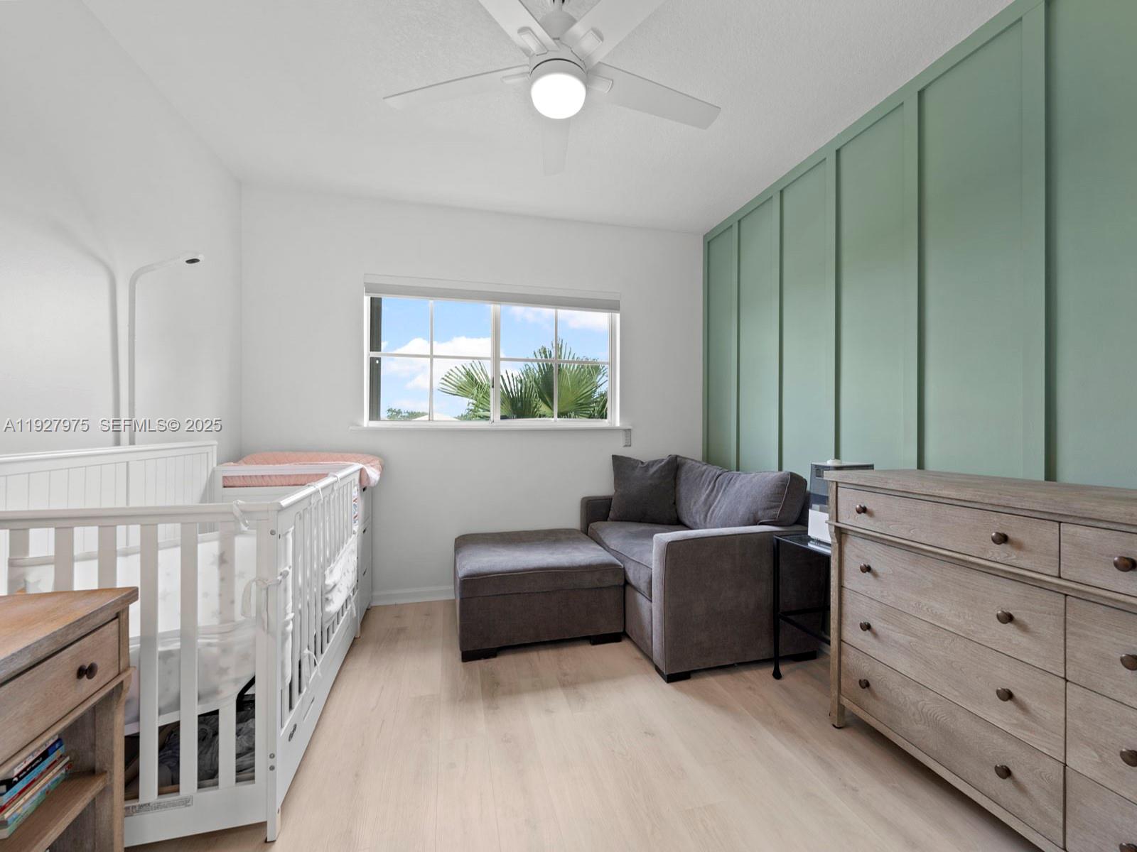 12881 Southwest 49th Court, Unit 12881 Miramar, FL 33027 - Photo 26 of 47 a living room with furniture and two windows