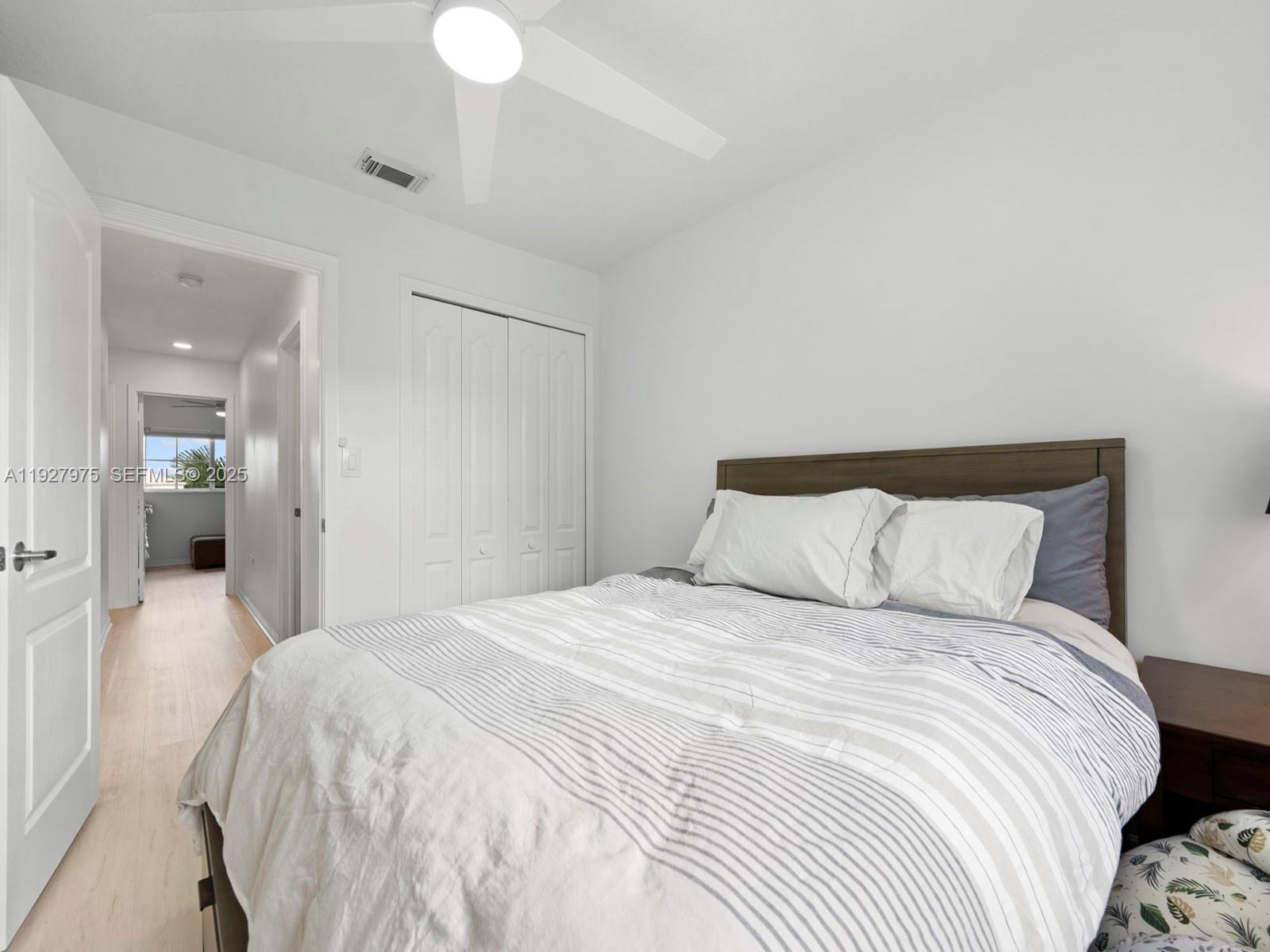 12881 Southwest 49th Court, Unit 12881 Miramar, FL 33027 - Photo 32 of 47 a large white bed in a white room