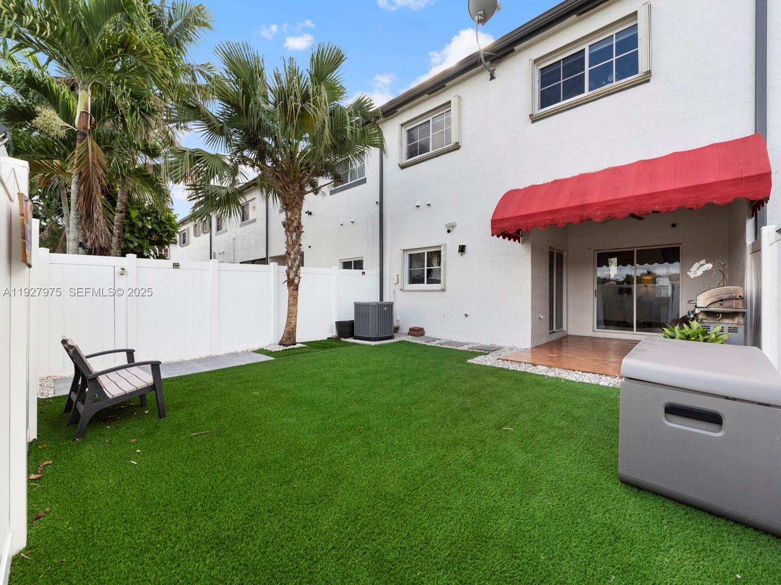 12881 Southwest 49th Court, Unit 12881 Miramar, FL 33027 - Photo 33 of 47 a view of a house with backyard